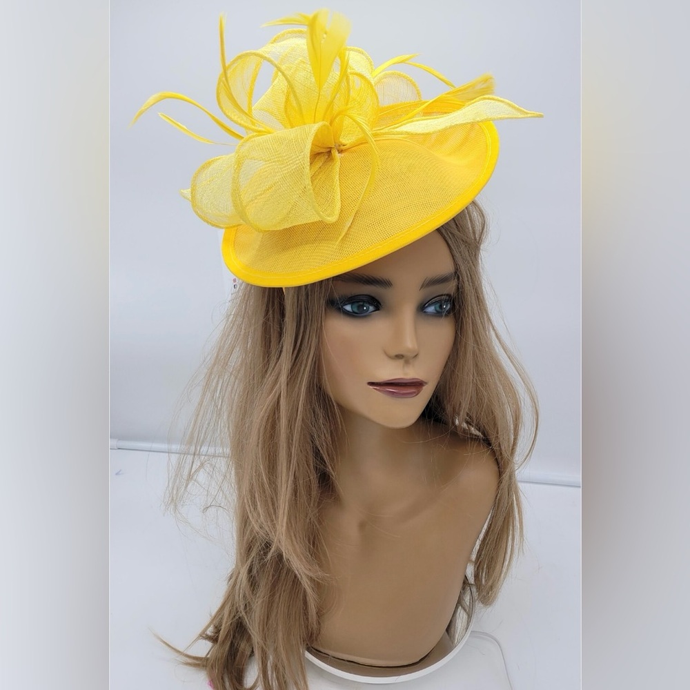 Golden yellow Derby fascinator with feather trimming.